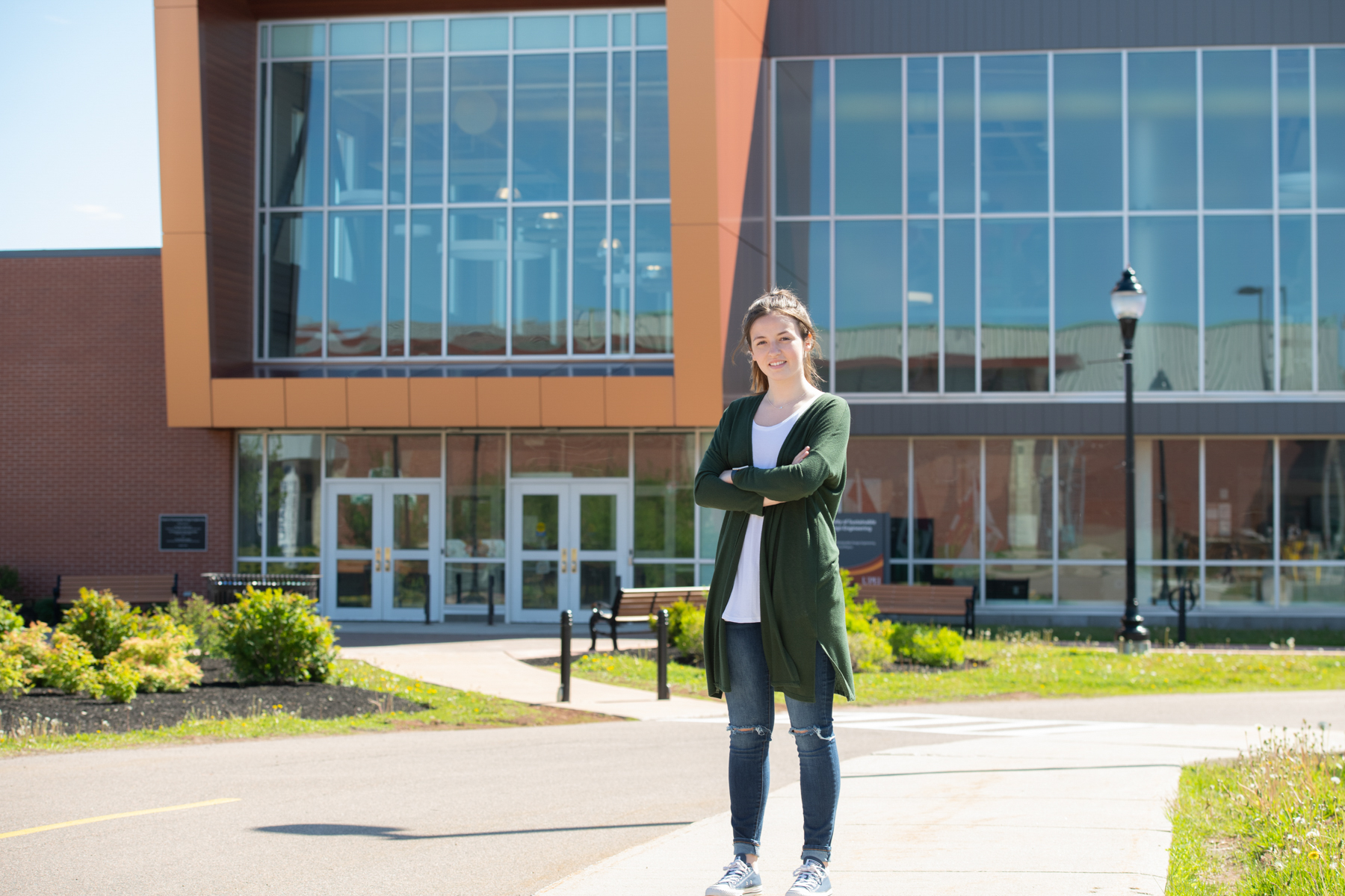 UPEI student Sydney Wheatley in front of the sustainable design engineering building