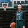 UPEI student and basketball guard Lauren Rainford holding a basketball